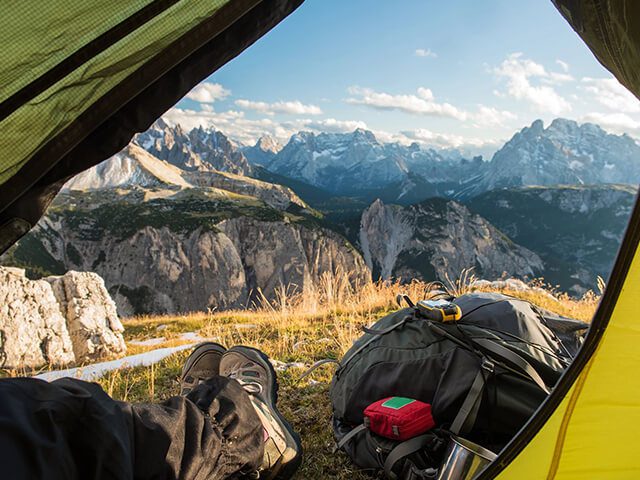 A view of mountains from inside a tent.