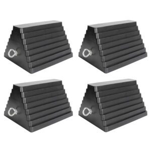 A set of four black and silver triangular shaped ramps.