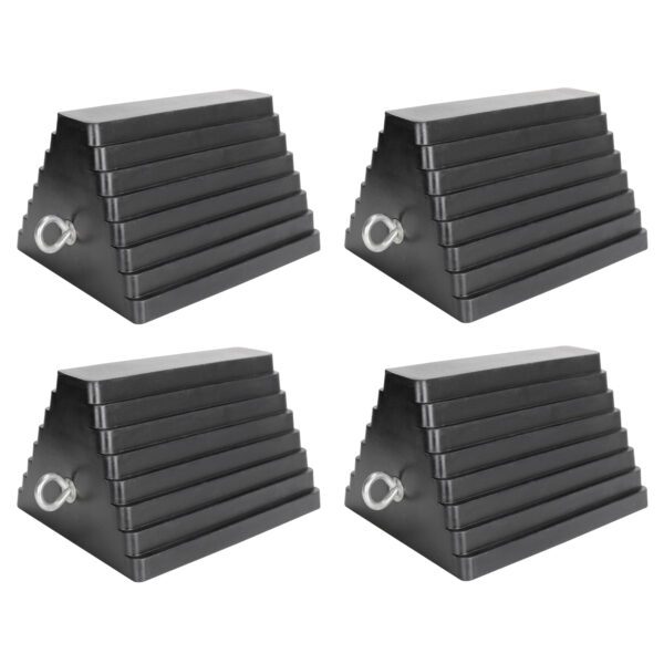 A set of four black and silver triangular shaped ramps.