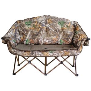 A camouflage couch with folding legs and padded seat.