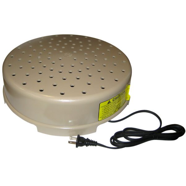 A round electric cake stand with a yellow label.