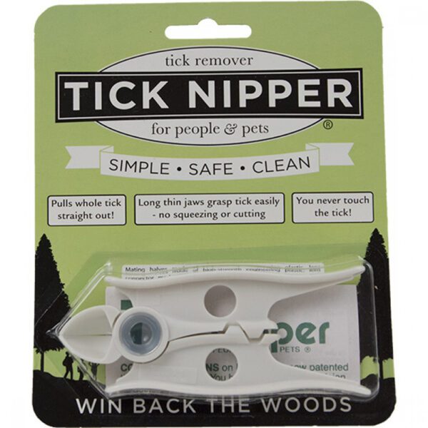 A white and black tick nipper on top of a package.