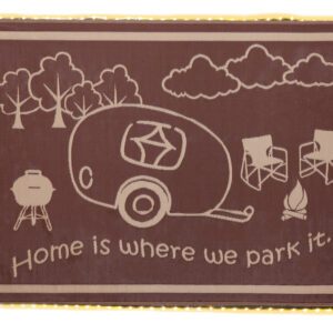 A brown rug with an rv and trees on it.