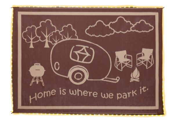 A brown rug with an rv and trees on it.