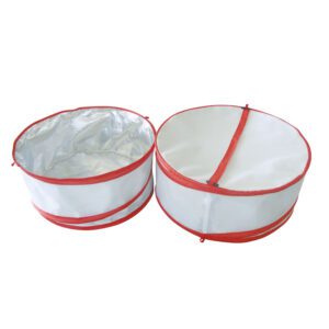 Two round white containers with red trim on top of each other.